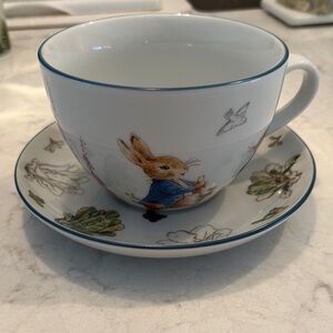 PETER REBBIT CUP AND SAUCER SET.      NWOT